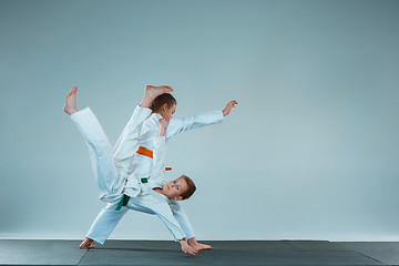 Image showing The boy fighting at Aikido training in martial arts school. Healthy lifestyle and sports concept