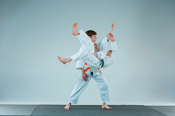 Image showing The two boys fighting at Aikido training in martial arts school. Healthy lifestyle and sports concept