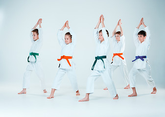 Image showing The group of boys and girl fighting at Aikido training in martial arts school. Healthy lifestyle and sports concept