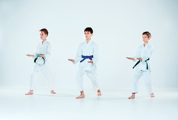 Image showing The group of boys fighting at Aikido training in martial arts school. Healthy lifestyle and sports concept