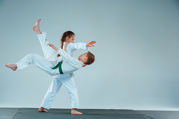 Image showing The boy fighting at Aikido training in martial arts school. Healthy lifestyle and sports concept