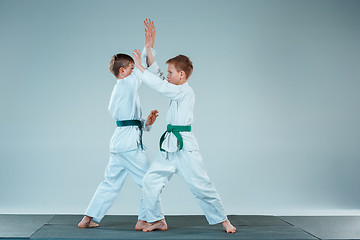 Image showing The two boys fighting at Aikido training in martial arts school. Healthy lifestyle and sports concept