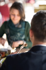 Image showing Closeup shot of young woman and man having meal.