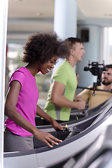 Image showing people exercisinng a cardio on treadmill in gym