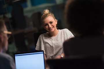 Image showing Multiethnic startup business team in night office