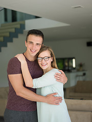 Image showing couple hugging in their new home