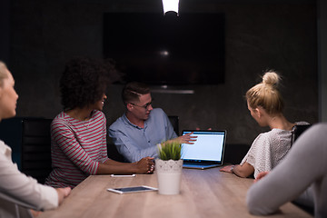 Image showing Multiethnic startup business team in night office