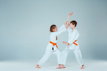 Image showing The boy fighting at Aikido training in martial arts school. Healthy lifestyle and sports concept