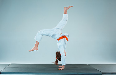 Image showing The girl posing at Aikido training in martial arts school. Healthy lifestyle and sports concept