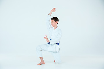 Image showing The boy posing at Aikido training in martial arts school. Healthy lifestyle and sports concept