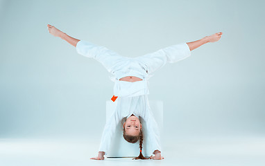 Image showing The girl posing at Aikido training in martial arts school. Healthy lifestyle and sports concept