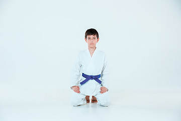 Image showing The boy posing at Aikido training in martial arts school. Healthy lifestyle and sports concept