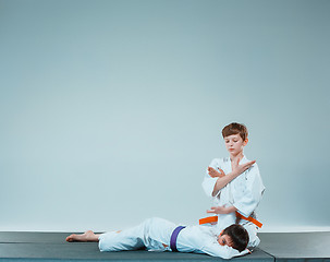 Image showing The two boys fighting at Aikido training in martial arts school. Healthy lifestyle and sports concept