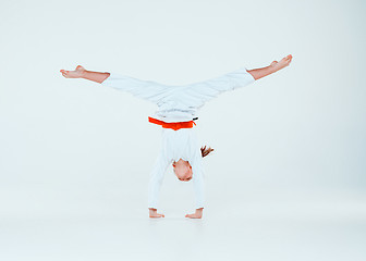 Image showing The girl posing at Aikido training in martial arts school. Healthy lifestyle and sports concept