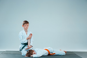 Image showing The two boys fighting at Aikido training in martial arts school. Healthy lifestyle and sports concept