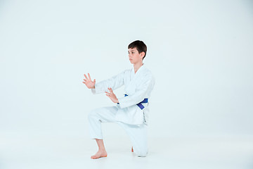 Image showing The boy posing at Aikido training in martial arts school. Healthy lifestyle and sports concept