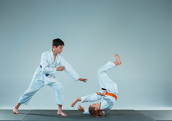 Image showing The boy fighting at Aikido training in martial arts school. Healthy lifestyle and sports concept