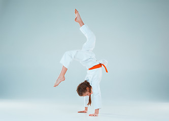 Image showing The girl posing at Aikido training in martial arts school. Healthy lifestyle and sports concept