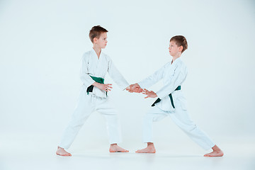 Image showing The two boys fighting at Aikido training in martial arts school. Healthy lifestyle and sports concept