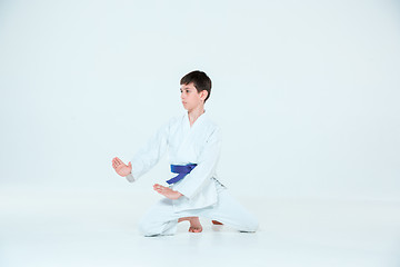 Image showing The boy posing at Aikido training in martial arts school. Healthy lifestyle and sports concept