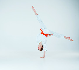 Image showing The boy posing at Aikido training in martial arts school. Healthy lifestyle and sports concept