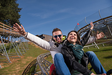 Image showing couple enjoys driving on alpine coaster