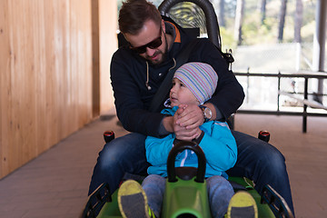 Image showing father and son enjoys driving on alpine coaster