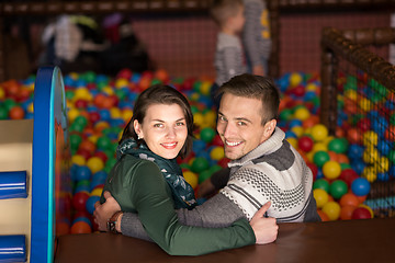 Image showing young parents with kids in a children\'s playroom