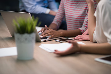 Image showing Multiethnic startup business team in night office