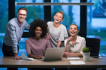 Image showing Multiethnic startup business team in night office