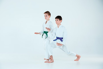 Image showing The boys posing at Aikido training in martial arts school. Healthy lifestyle and sports concept