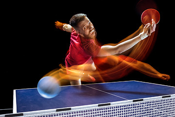 Image showing The table tennis player serving