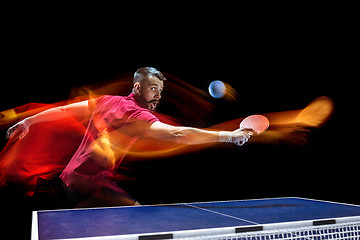 Image showing The table tennis player serving