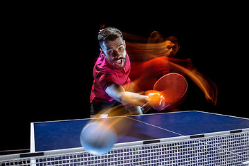 Image showing The table tennis player serving