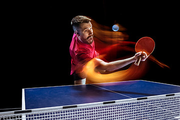 Image showing The table tennis player serving