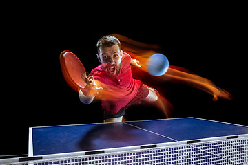 Image showing The table tennis player serving