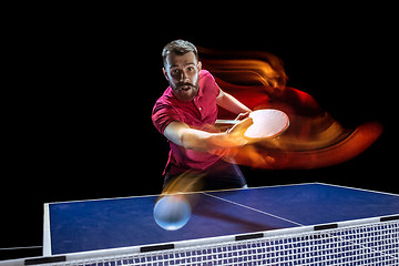 Image showing The table tennis player serving