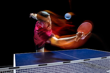 Image showing The table tennis player serving