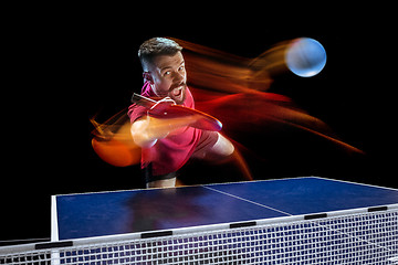 Image showing The table tennis player serving