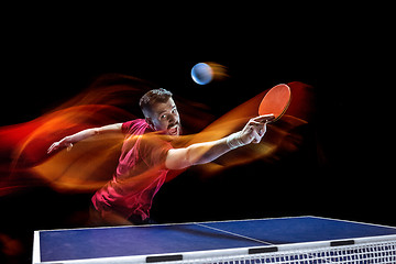 Image showing The table tennis player serving