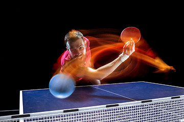 Image showing The table tennis player serving