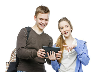 Image showing Teen boy and girl standing with mobile phones