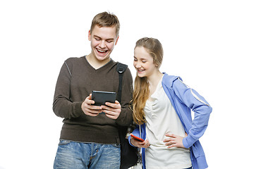 Image showing Teen boy and girl standing with mobile phones