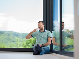 Image showing man on the floor enjoying relaxing lifestyle