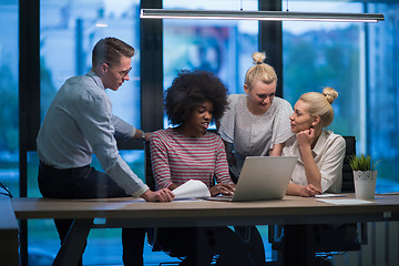 Image showing Multiethnic startup business team in night office