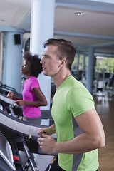 Image showing people exercisinng a cardio on treadmill in gym