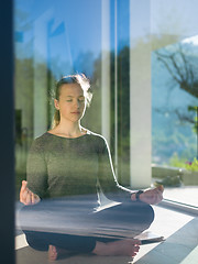 Image showing young woman doing morning yoga exercises