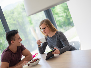 Image showing couple enjoying morning coffee and strawberries