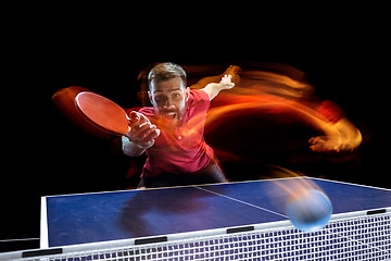 Image showing The table tennis player serving