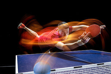 Image showing The table tennis player serving